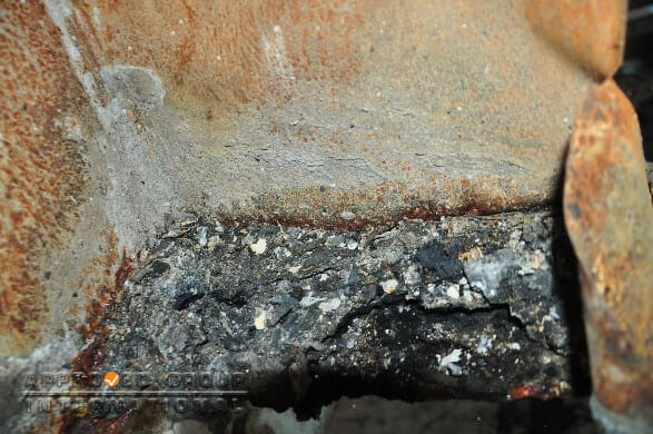 Figure 6: Close-up view of the remains of charred creosote within the vertical exhaust duct.