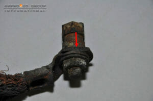 A portion of the terminal was found with a fractured mark (red arrow) which initially was connected to the cable with molten copper with a protruding shape.