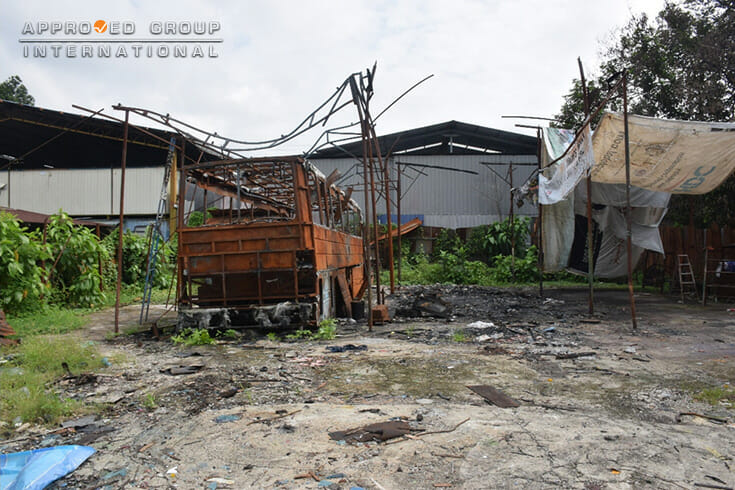 Photograph 1: Overview of the fire-affected Bus in the workshop